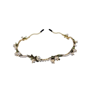Elegant lily of the valley floral headband with pearls and gold wire craft