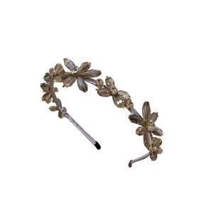 Elegant purple satin headband featuring vintage crystal flowers and gold bead accents