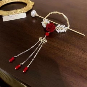 Vintage gold hair pin with red velvet rose, pearls and elegant metal tassels for women