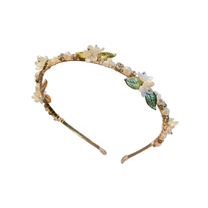 Elegant floral pearl headband with gold metal frame and sparkling crystal accents