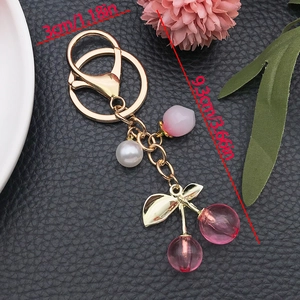 Pink cherry pearl keychain with gold metal ring and heart charm for bag decoration