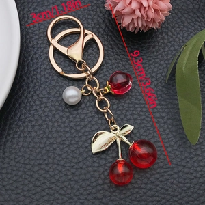 Creative resin cherry pendant keychain with pearl and gold metal leaf charm for bags