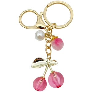 Pink resin cherry keychain with golden lobster clasp and decorative white pearls