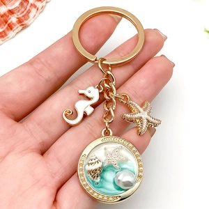 Porte-clés océan doré avec hippocampe, étoile de mer et pendentif coquillage en résine