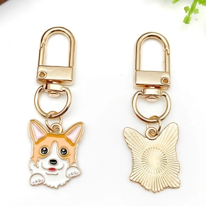Cute Corgi cartoon keychain with yellow and white enamel finish on a golden D-ring hook