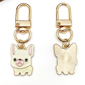 Cartoon French Bulldog enamel keychain in cream yellow with golden rotating U-hook