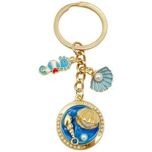 Porte-clés thème marin doré avec pendentifs hippocampe coquillage et émail bleu