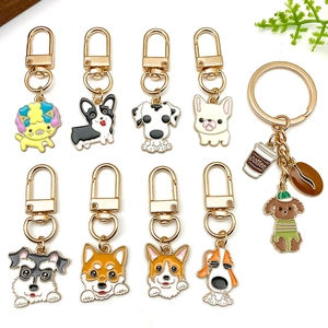 Cartoon enamel dog breed keychains with Schnauzer and Corgi charms on zinc alloy