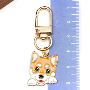 Detailed size measurement of a cute enamel Corgi dog keychain with golden lobster clasp