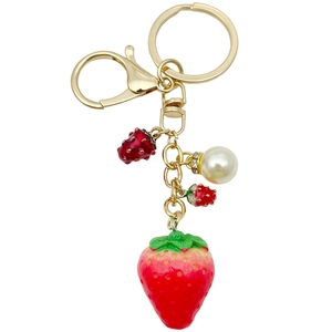 Realistic resin strawberry keychain with pearl detail and gold-plated metal clasp