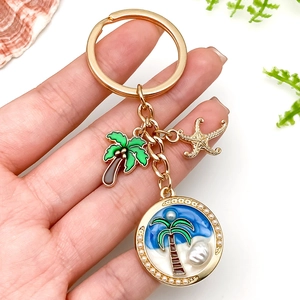 Porte-clés en alliage doré avec palmier, étoile de mer et breloques en perles