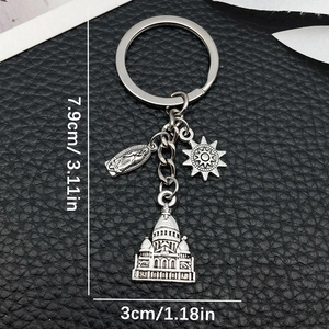 Antique silver keychain with Mary, sun wheel, and castle charms on black leather