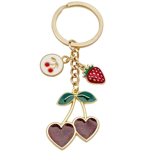 Golden cherry and strawberry fruit pendant keychain with sparkly red enamel and charms