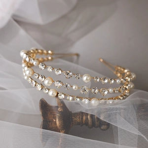 Elegant three-layer gold bridal headband with sparkling pearls and rhinestones for weddings