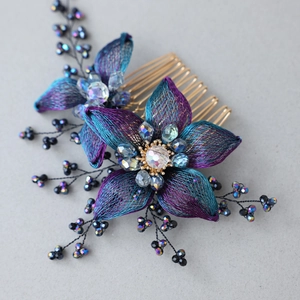 Elegant handmade floral hair comb with gradient blue-purple woven petals and crystal beads