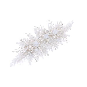 Macro shot of silver bridal headband with opal beads and crystals for weddings