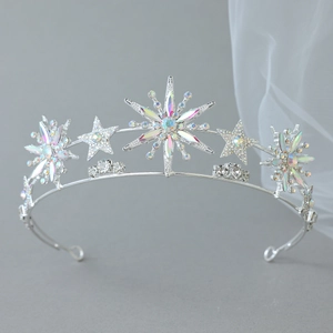 Macro detail of bridal star crown with sparkling rhinestones on elegant tulle fabric