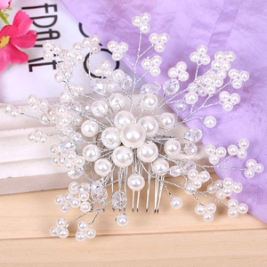 Detailed view of handmade crystal pearl bridal hair comb with silver wire weaving