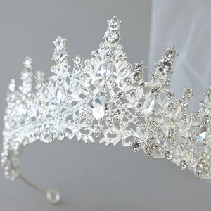 Elegant silver bridal crown with sparkling rhinestones and filigree design for weddings