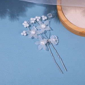 Elegant bridal hair pin with white frosted flowers and pearls for wedding hairstyles