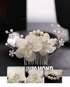 Detail view of European bridal hair comb with silk flowers, rhinestones and pearls