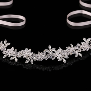 Elegant bridal crystal headband with sparkling leaf patterns and white satin ribbons