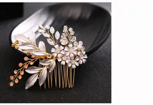 Detailed craftsmanship of bridal floral hair comb with white flowers and crystal beads