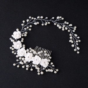 Handmade bridal hair band with white ceramic flowers, pearls and silver wire weaving