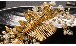 Detailed macro view of handmade gold bridal hair comb with pearls and crystal leaves