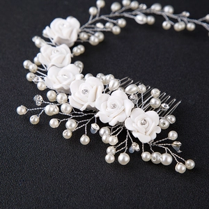 Handmade bridal hair comb with white roses, faux pearls and crystals on a silver metal base