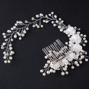Handmade bridal hair comb with elegant white pearls and delicate fabric flowers