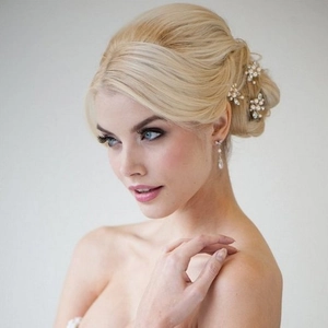 Elegant bridal hair pin set with white pearls and crystals including matching earrings