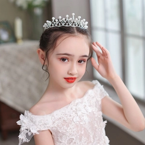 Elegant bridal tiara with pearls and rhinestones on a wavy silver metal frame for weddings