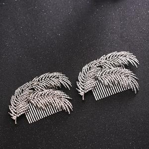 Elegant bridal hair combs with silver feather design and shimmering white crystals