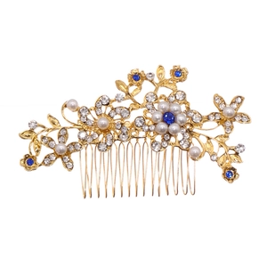 Elegant gold bridal hair comb with blue rhinestones and pearls for wedding hairstyles