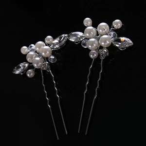 Detail view of pearl and crystal bridal hair pins with handcrafted silver wire design