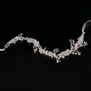 Elegant bridal hair band with white pearls and crystals on silver wire for wedding hair