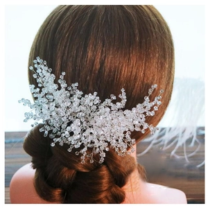 Detail of handmade bridal hair comb with silver wire and transparent crystal beads