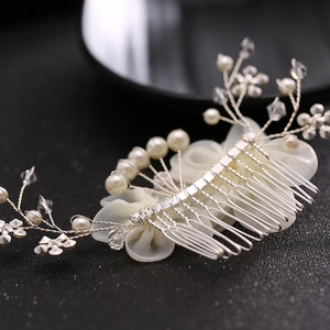 Exquisite bridal hair comb with white fabric flowers, pearls and crystal accents on silver pins