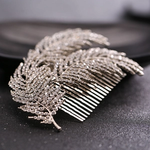 Elegant silver feather bridal hair comb with crystal rhinestones for wedding hairstyles