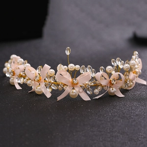 Exquisite bridal headband with pink silk bows, pearls and crystals on gold wire base