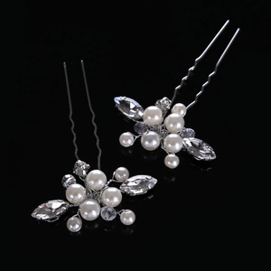 Detail of U-shaped bridal hair pins with white pearls and clear crystal floral clusters