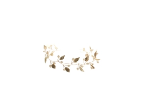 Detailed shot of handmade golden metal leaf and pearl bridal headband for wedding hairstyles
