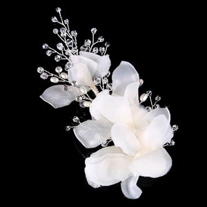 Elegant bridal handmade white flower hair clip with pearls and crystals on black background