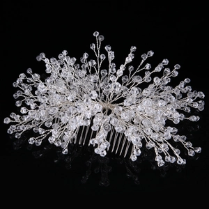 Detailed macro view of handmade silver wire twists and crystal beads on bridal hair comb