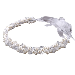 Elegant bridal headband featuring handmade pearls, crystal beads, and organza ribbons