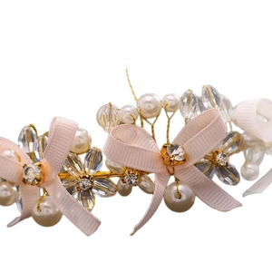 Elegant bridal headband with pink ribbon bows, white pearls and gold crystal beads