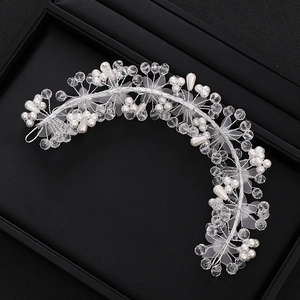 Handmade bridal hair vine with silver wire, white pearls, and crystals for wedding hairstyles
