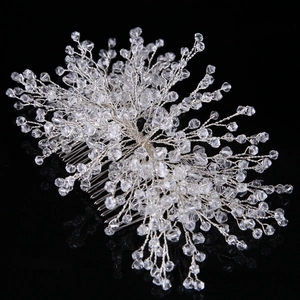 Detail of silver bridal hair comb with handmade crystal beads on a black reflective surface