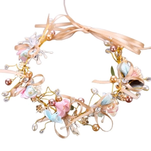 Handmade bridal flower headband with pink and blue blossoms and champagne ribbons